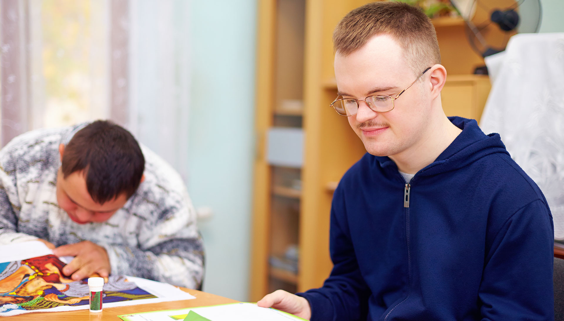 man with a disablity reading